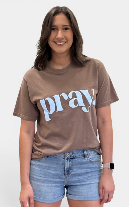 Women's faith graphic tee featuring Pray puff print on a relaxed cotton T-shirt.