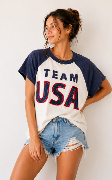 Woman wearing a 'Team USA' t-shirt against a white background