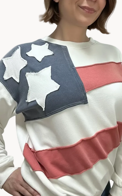 Close-up of a mineral-washed USA vintage pullover featuring an American flag patch on the front, relaxed oversized fit, and soft French terry knit — photographed for Justyna Grace Boutique.