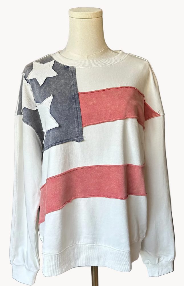 Close-up of a mineral-washed USA vintage pullover featuring an American flag patch on the front, relaxed oversized fit, and soft French terry knit — photographed for Justyna Grace Boutique.