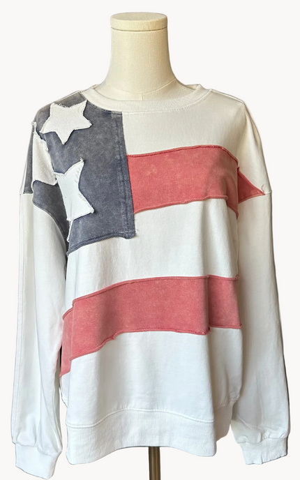 Close-up of a mineral-washed USA vintage pullover featuring an American flag patch on the front, relaxed oversized fit, and soft French terry knit — photographed for Justyna Grace Boutique.
