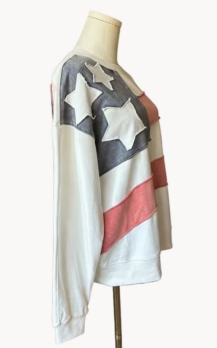 Close-up of a mineral-washed USA vintage pullover featuring an American flag patch on the front, relaxed oversized fit, and soft French terry knit — photographed for Justyna Grace Boutique.
