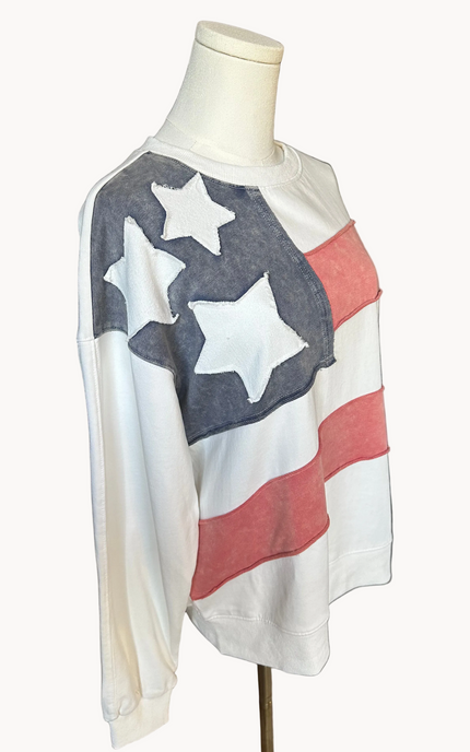 Close-up of a mineral-washed USA vintage pullover featuring an American flag patch on the front, relaxed oversized fit, and soft French terry knit — photographed for Justyna Grace Boutique.