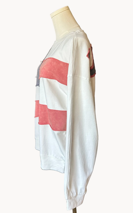 Close-up of a mineral-washed USA vintage pullover featuring an American flag patch on the front, relaxed oversized fit, and soft French terry knit — photographed for Justyna Grace Boutique.