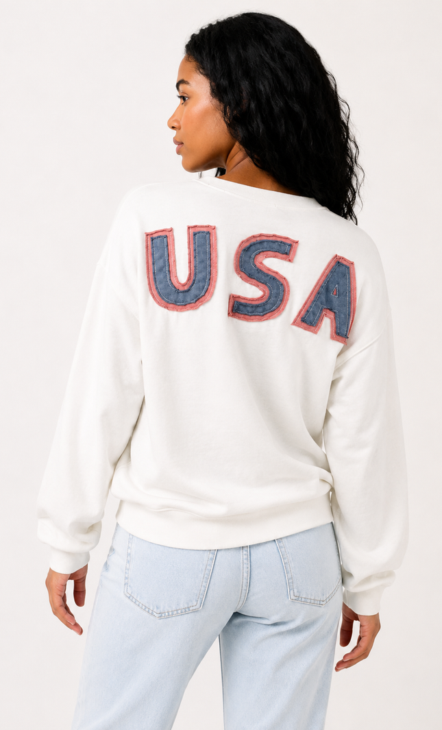 Back view of women's oversized sweatshirt with bold USA lettering.