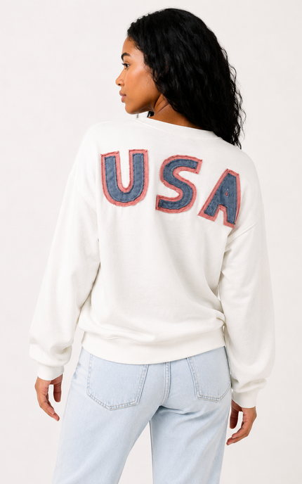 Back view of women's oversized sweatshirt with bold USA lettering.