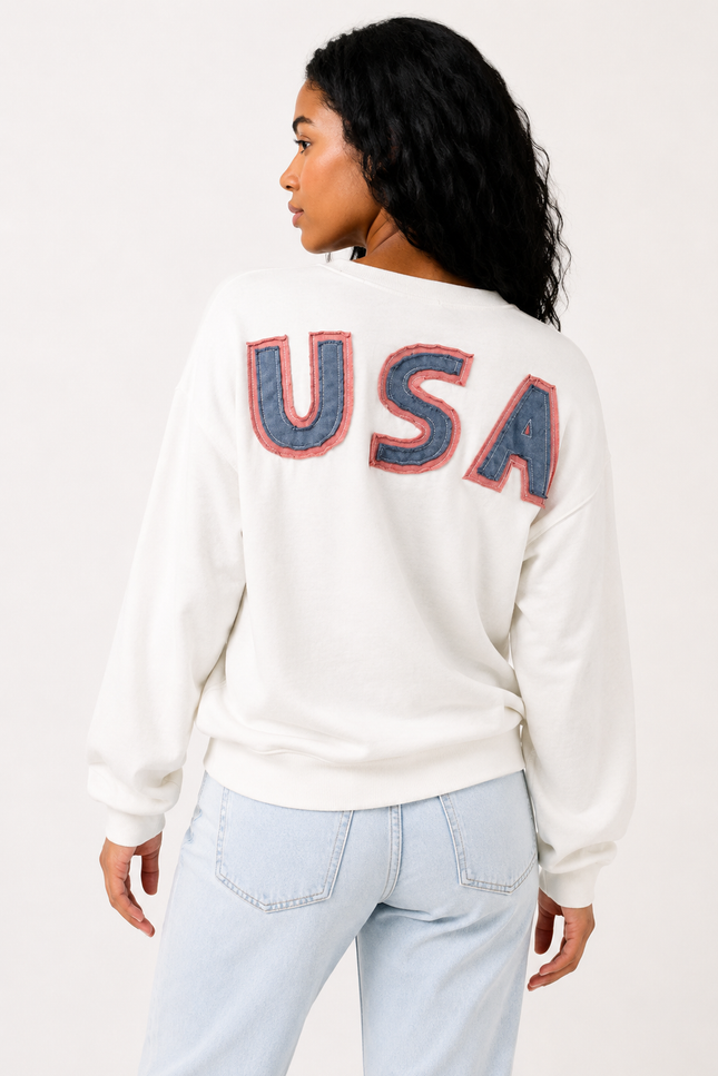 Back view of women's oversized sweatshirt with bold USA lettering.