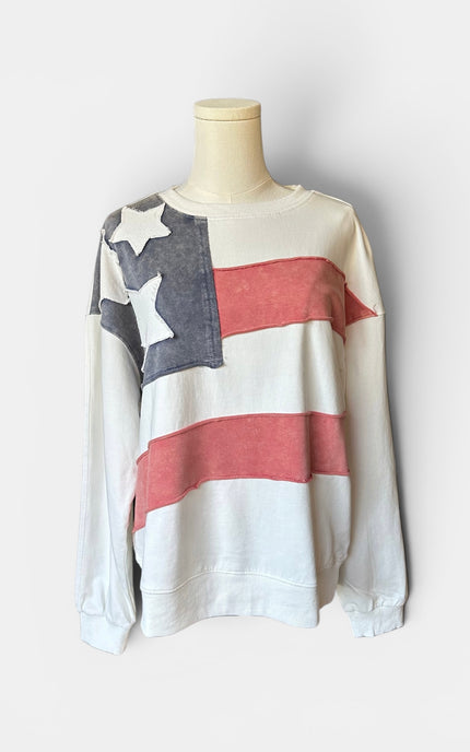 Front view of women's mineral wash USA pullover with American flag patch.