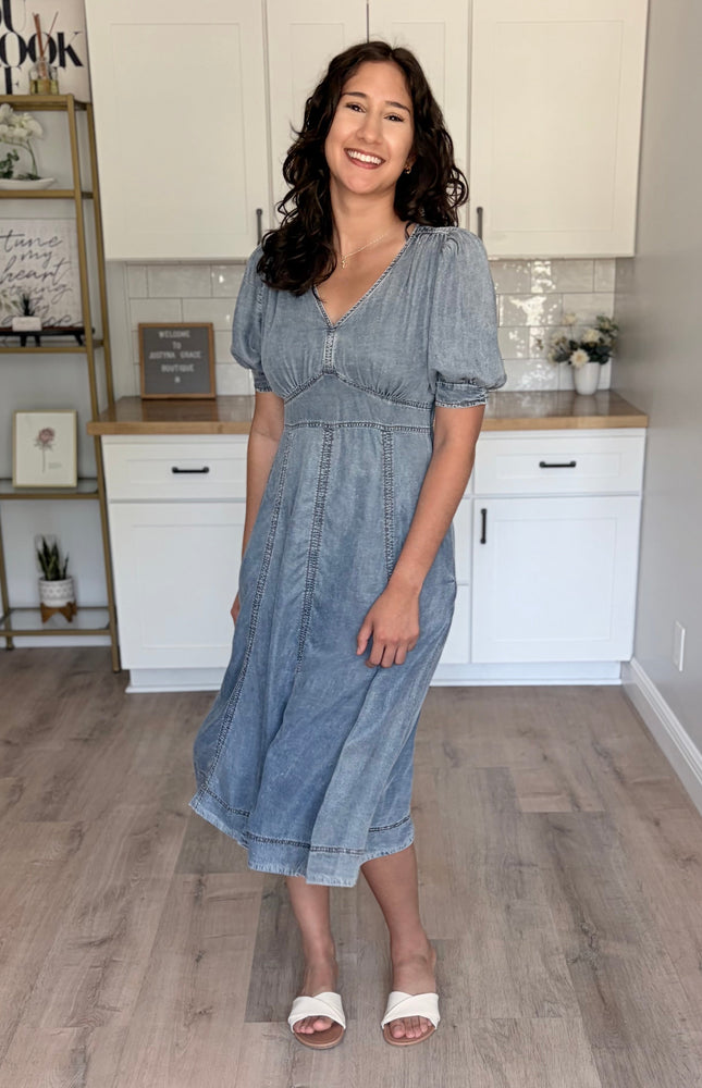 A size Medium Tencel puff sleeve dress on a model with a 37" bust, showing the comfortable and flattering fit.