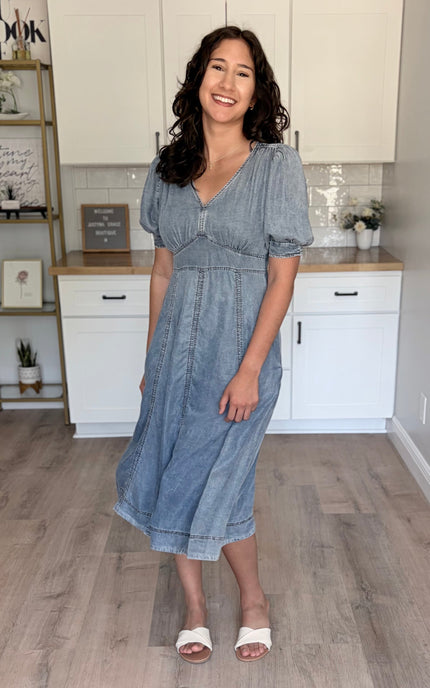 A size Medium Tencel puff sleeve dress on a model with a 37" bust, showing the comfortable and flattering fit.