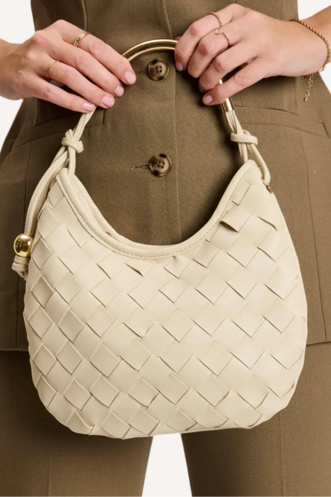 Vivienne woven hobo bag with sculpted crescent silhouette, featuring a woven front panel, gold hardware, and curved metal top handle.