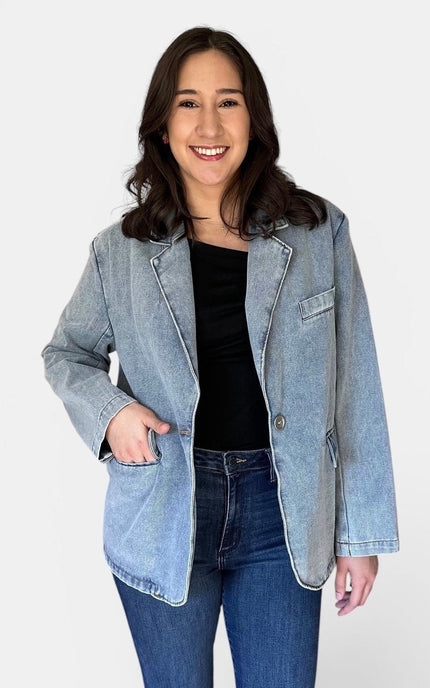 Front view of women's oversized washed denim blazer.