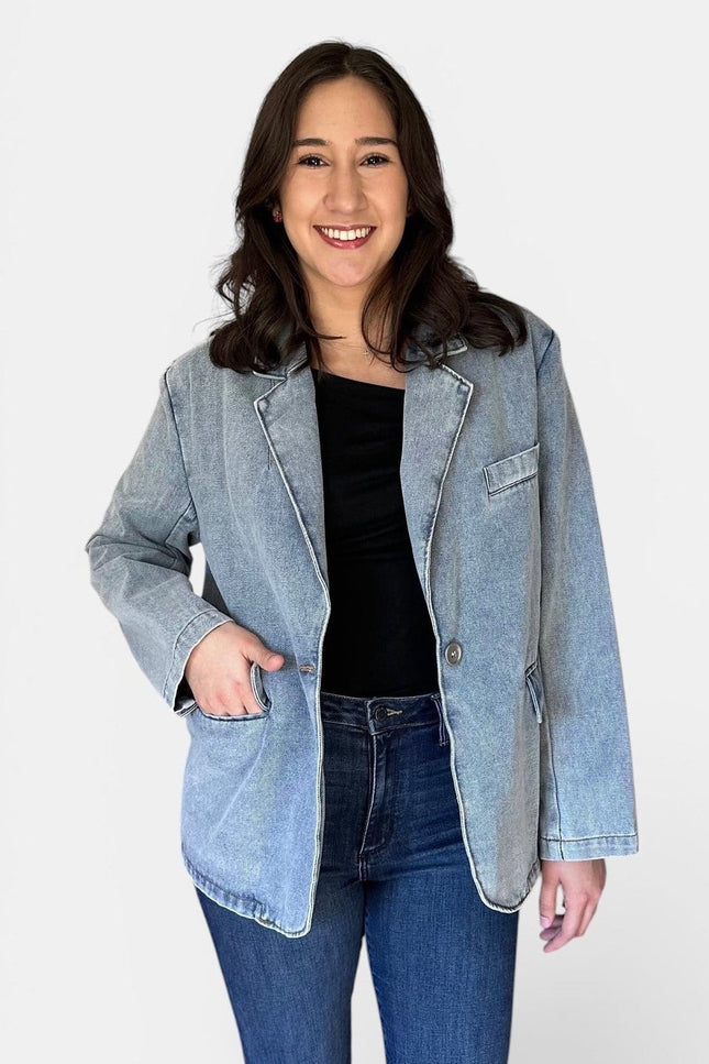 Front view of women's oversized washed denim blazer.