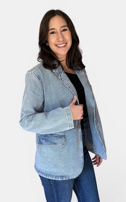 Side view of women's oversized denim blazer.