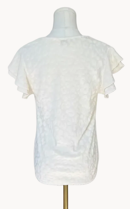 Louisiana Top with subtle tonal animal-print texture, soft ruffle sleeves, and V-neckline – lightweight relaxed silhouette – front view on soft linen background – Justyna Grace Boutique