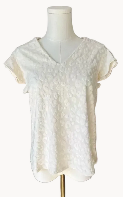 Louisiana Top with subtle tonal animal-print texture, soft ruffle sleeves, and V-neckline – lightweight relaxed silhouette – front view on soft linen background – Justyna Grace Boutique