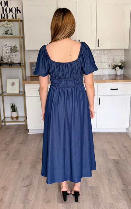 Back view of Arabelle French blue smocked Tencel midi dress with bubble sleeves and A-line skirt