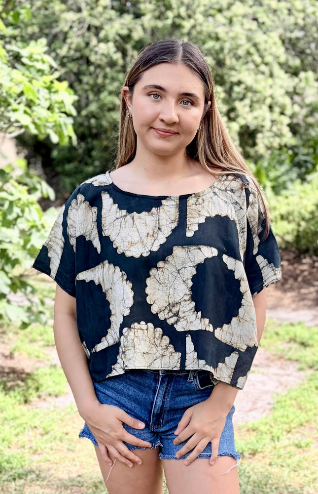 Black and ivory sunburst pattern detail on artisan top