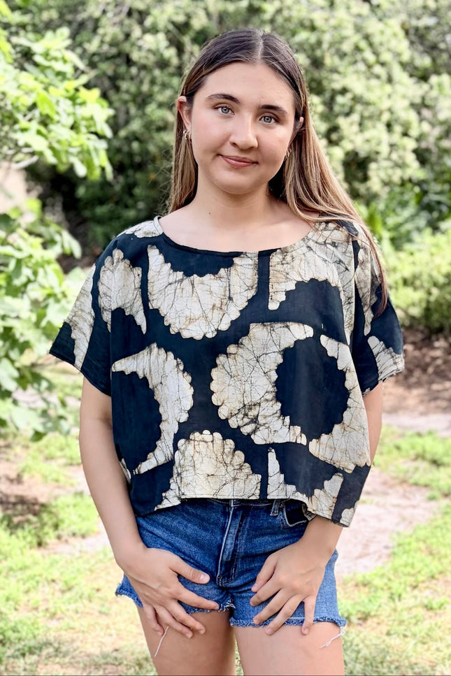 Black and ivory sunburst pattern detail on artisan top