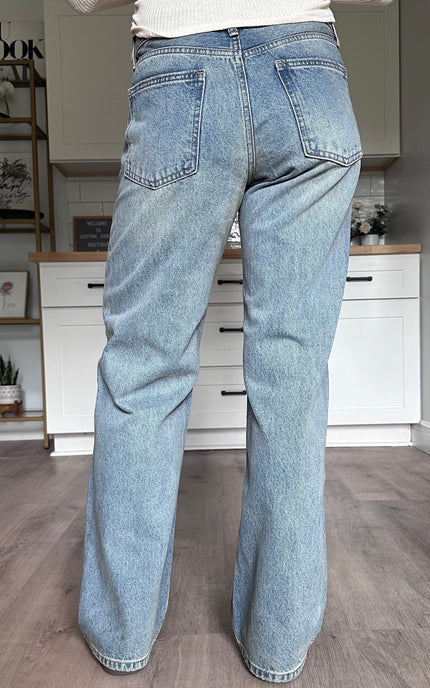 Back view of the Audrey straight leg jeans with vintage wash and timeless fit