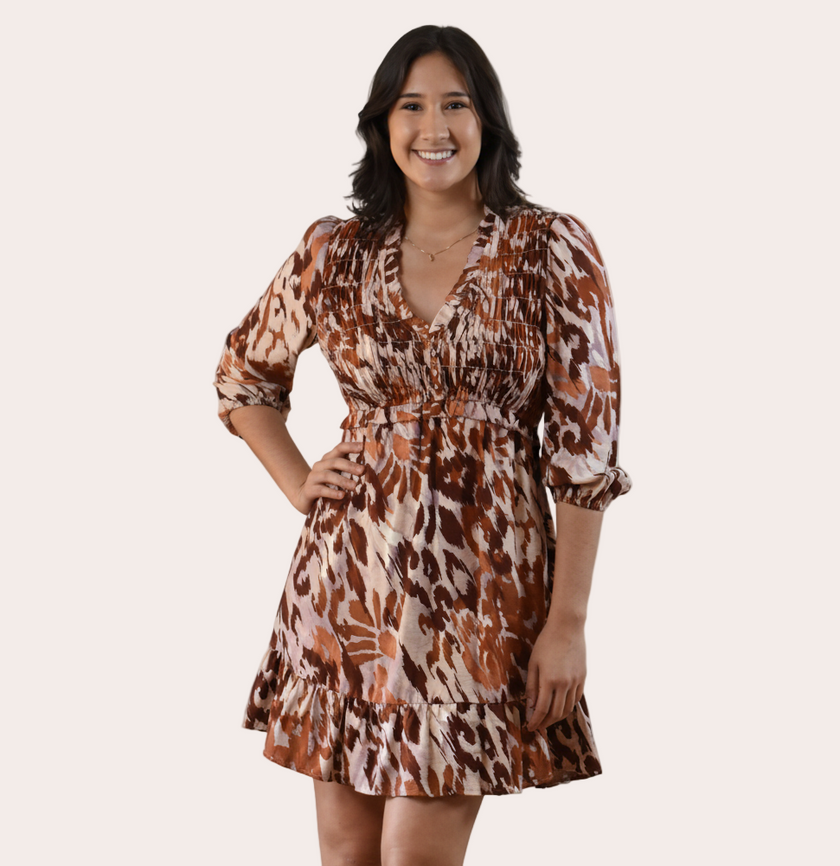 The Autumn Whisper Smocked Mini Dress in nude and brown — lightweight crinkle gauze with ruffle trim and smocked bodice from Justyna Grace Boutique.