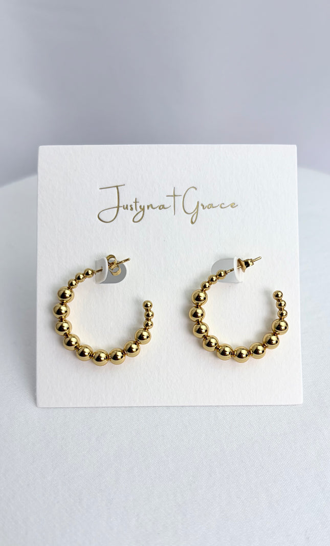Beaded hoop earrings in 18k gold PVD over 316L stainless steel with textured beaded design and polished finish