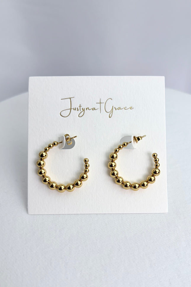 Beaded hoop earrings in 18k gold PVD over 316L stainless steel with textured beaded design and polished finish