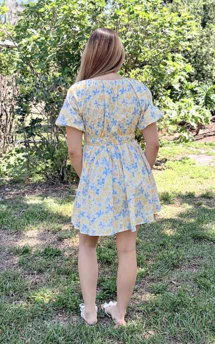 Back view of Bloom Bubble Sleeve Dress showing hidden side pocket, fully lined construction, and bubble sleeve detail on woman wearing size Small