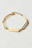 Bold in Spirit Bracelet — 14K gold-plated stainless steel bracelet engraved with “Fearless,” ethically made by survivors from Justyna Grace Boutique.