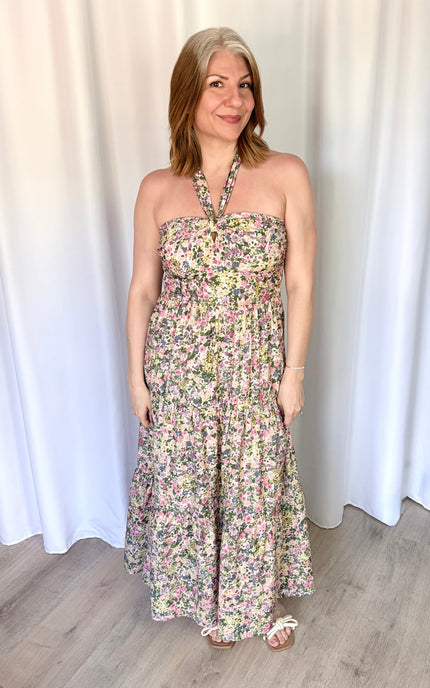 Full-length front view of the Catalina Floral Knot Maxi Dress from Justyna Grace Boutique, showcasing the vibrant floral print and elegant tiered skirt.