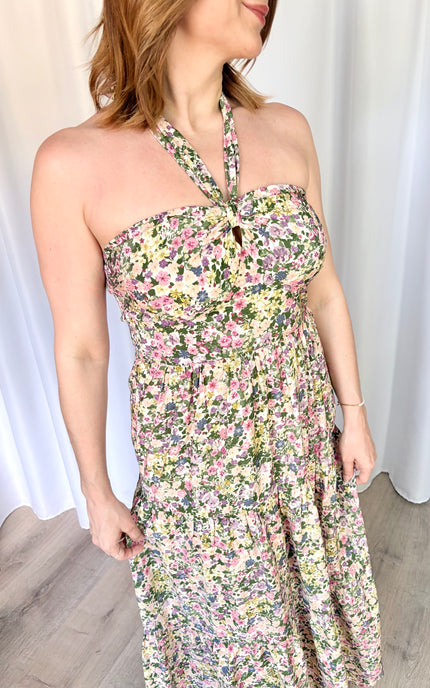 Close-up detail of the sweetheart neckline and front knot feature on the Catalina Floral Maxi Dress.