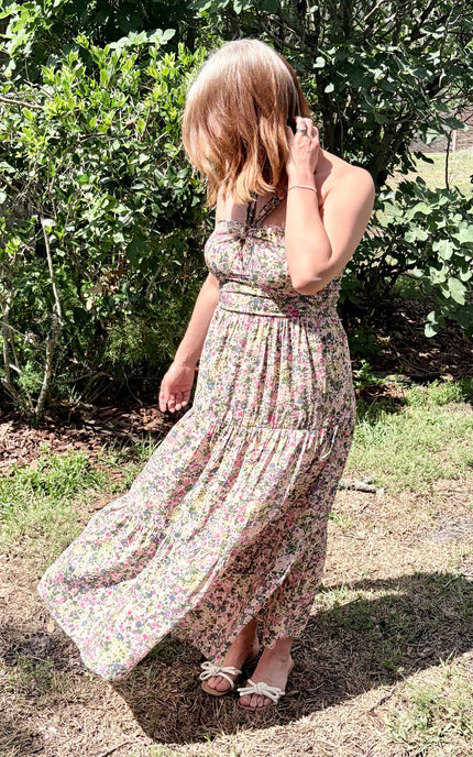 Golden hour outdoor portrait featuring the Catalina Floral Knot Maxi Dress, styled beautifully for a romantic, warm-weather look.