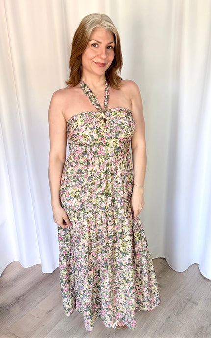 Full-length front view of the Catalina Floral Knot Maxi Dress from Justyna Grace Boutique, showcasing the vibrant floral print and elegant tiered skirt.