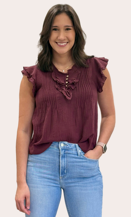 The Clara Pintuck Ruffle Top — lightweight 100% cotton blouse with ruffle neckline and button front from Justyna Grace Boutique.