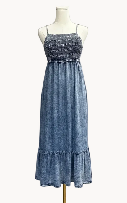Blue dress on a mannequin against a white background
