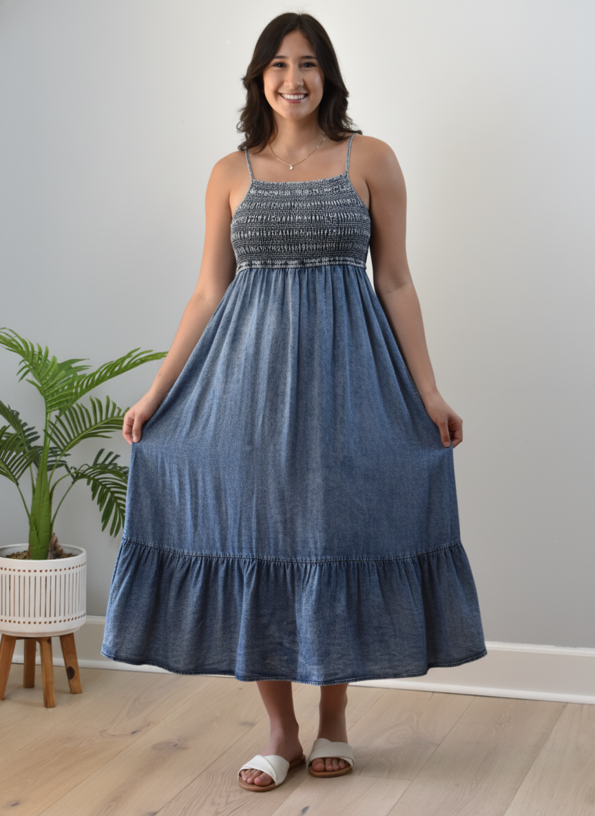 Blue washed Tencel midi dress with smocked top and tiered skirt — relaxed coastal charm from Justyna Grace Boutique.