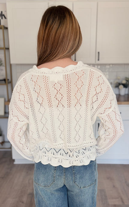 Model wearing cotton crochet button front sweater top layered over tank