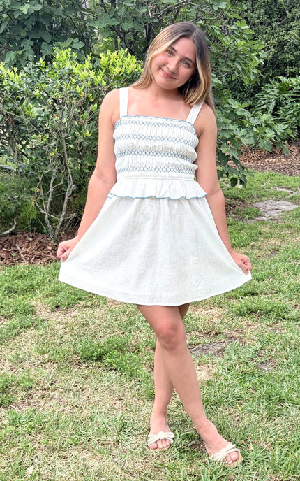 A model wearing the breathable cotton fit and flare dress, styled for a chic summer look.