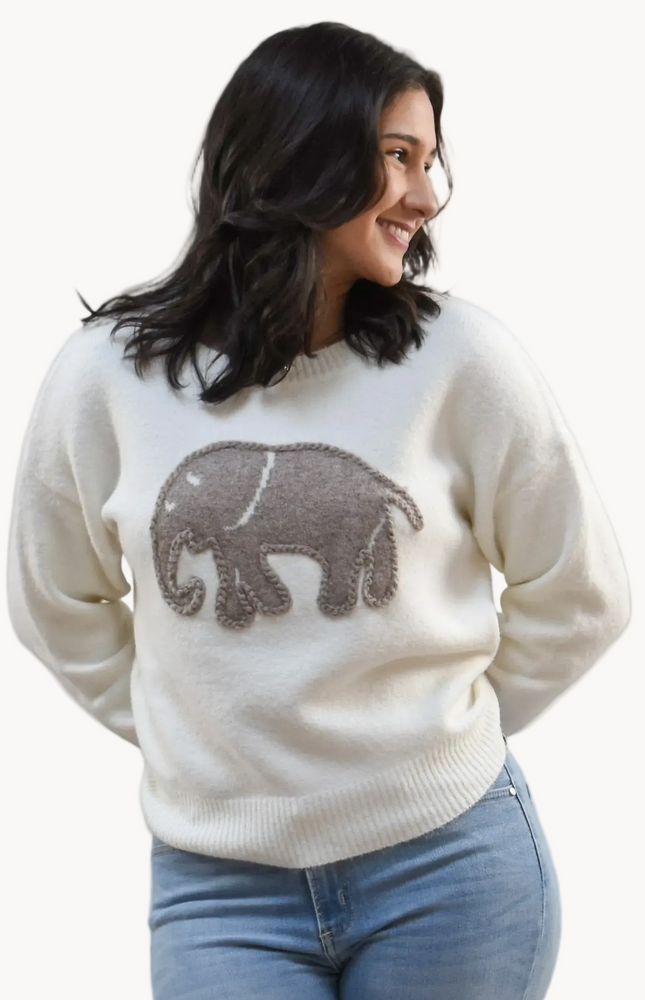 Cozy Elephant Sweater on soft linen background, featuring a centered elephant motif and relaxed crew-neck silhouette.