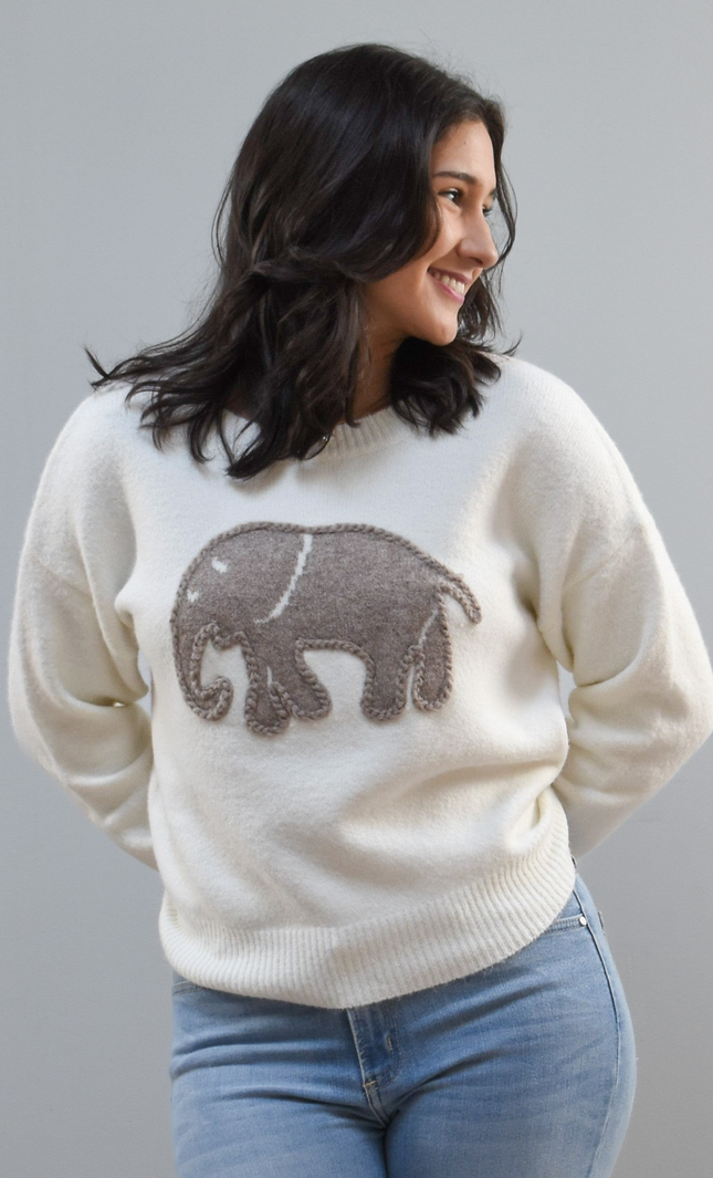 Cozy Elephant Sweater on soft linen background, featuring a centered elephant motif and relaxed crew-neck silhouette.