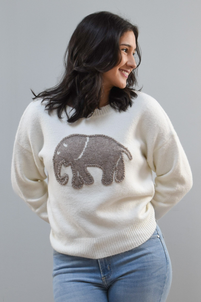 Cozy Elephant Sweater on soft linen background, featuring a centered elephant motif and relaxed crew-neck silhouette.