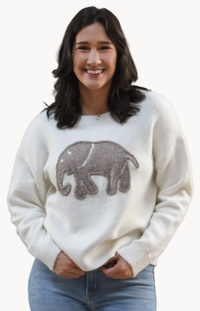 Cozy Elephant Sweater on soft linen background, featuring a centered elephant motif and relaxed crew-neck silhouette.