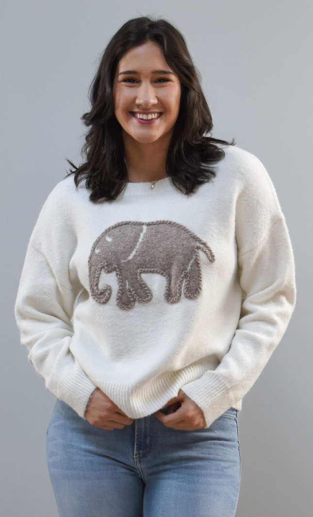 Cozy Elephant Sweater on soft linen background, featuring a centered elephant motif and relaxed crew-neck silhouette.