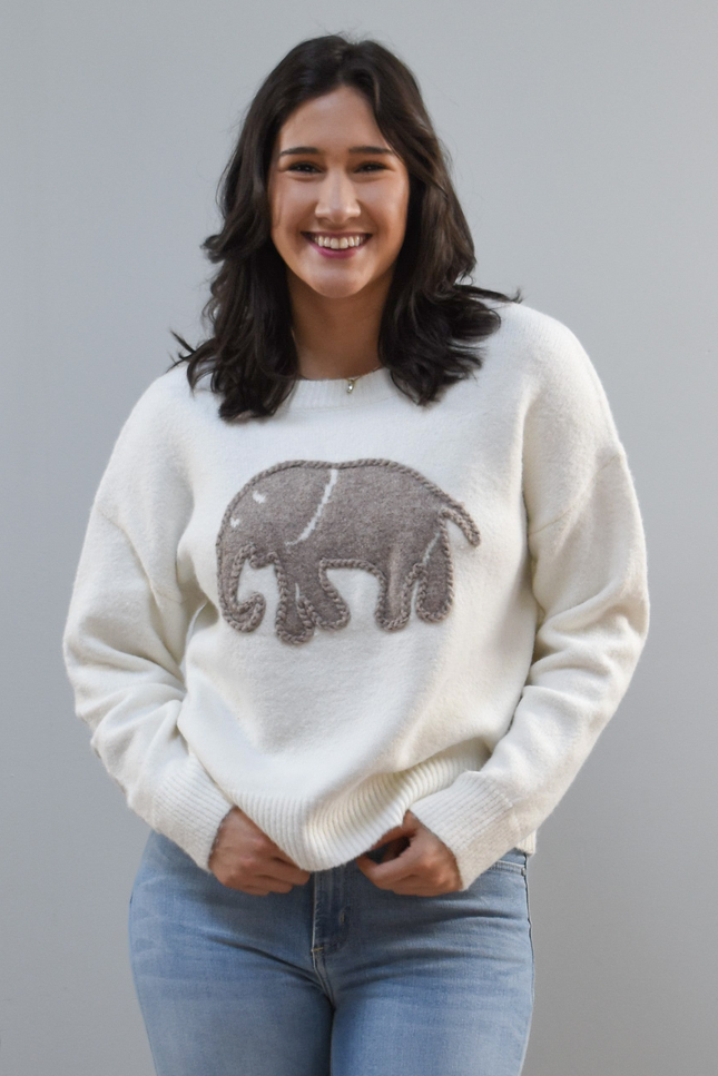 Cozy Elephant Sweater on soft linen background, featuring a centered elephant motif and relaxed crew-neck silhouette.