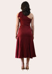 Cranberry Grace Dress with one-shoulder bow detail, slanted seamwork, and flared midi hem, designed for elegant movement, photographed on Soft Linen background.
