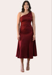 Cranberry Grace Dress with one-shoulder bow detail, slanted seamwork, and flared midi hem, designed for elegant movement, photographed on Soft Linen background.