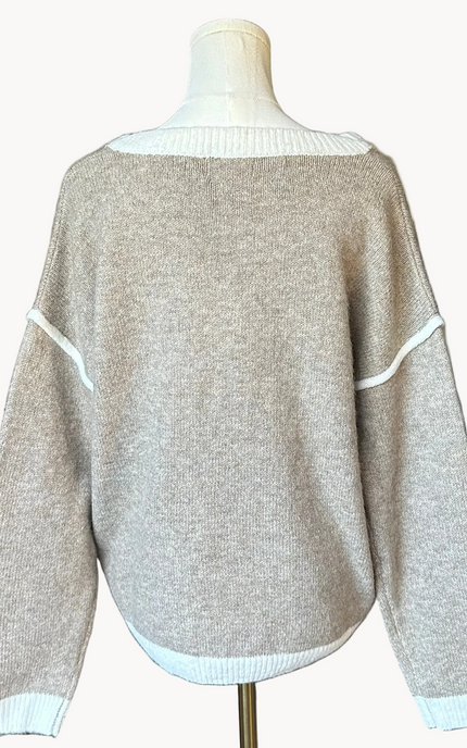 Mocha V-neck drop-shoulder sweater with floral appliqués and contrast trim at neckline, cuffs, and hem, photographed on a Soft Linen background for Justyna Grace Boutique.