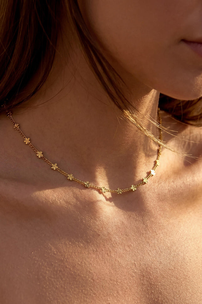 Delicate daisy necklace on model in motion, demonstrating lightweight comfort