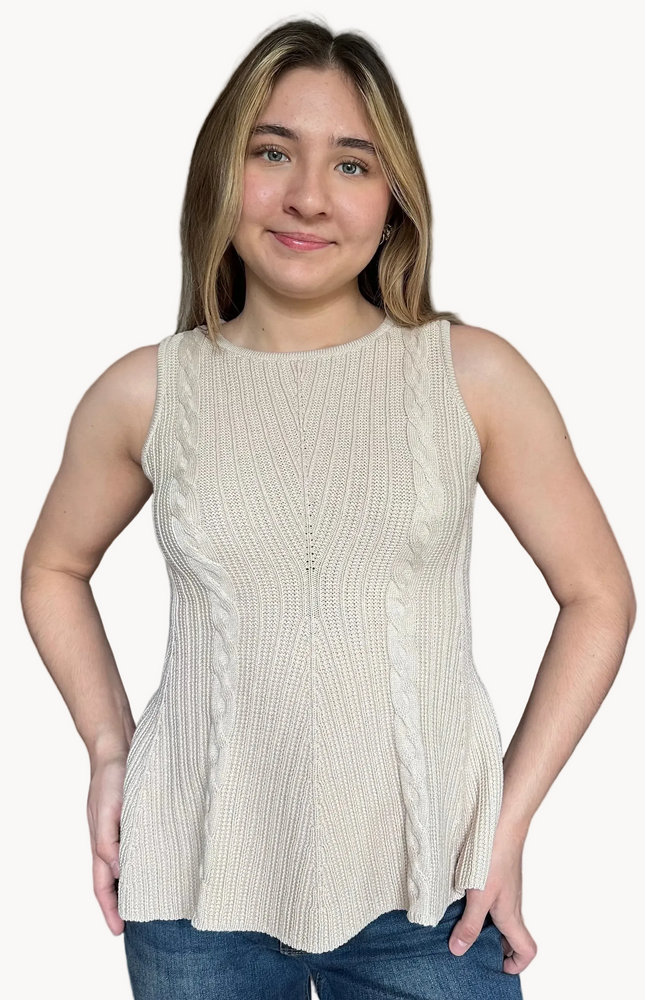 Woman wearing a beige sleeveless top on a white background
