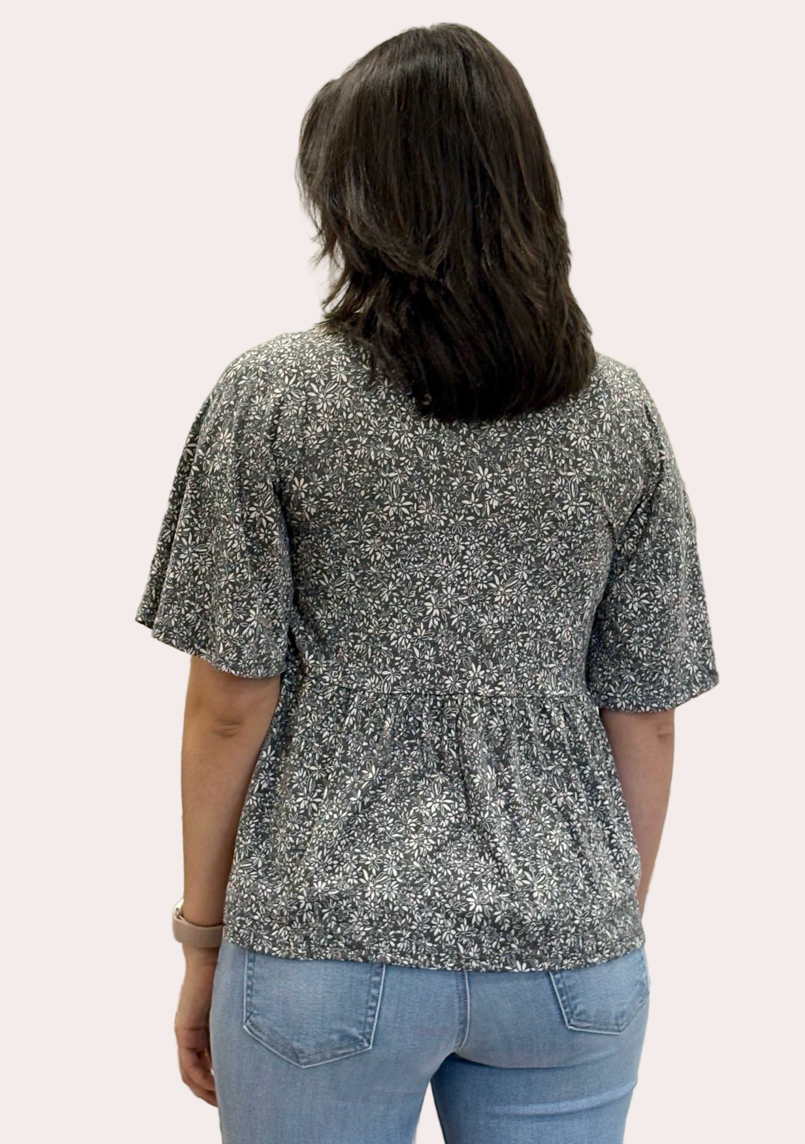 Ditsy Floral Babydoll Knit Top — soft floral print knit blouse with round neckline and ¾ sleeves from Justyna Grace Boutique.